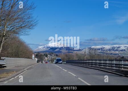 Driving towards the Snow topped Lomond hills past Milnathort, Kinross, Scotland Stock Photo