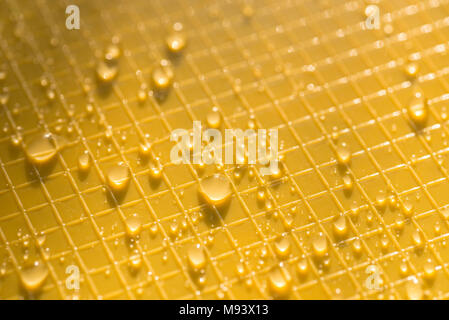 water drops on yellow color plastic background texture Stock Photo
