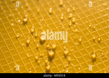 water drops on yellow color plastic background texture Stock Photo
