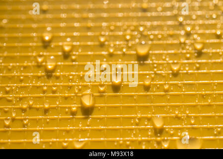 water drops on yellow color plastic background texture Stock Photo