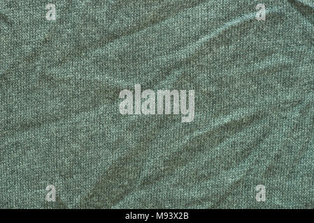 old creased knitted green wool texture background Stock Photo