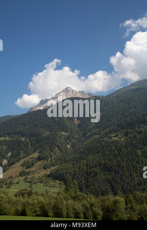 Bernina Railway links St. Moritz, Switzerland, with the town of Tirano, Italy, via the Bernina Pass Stock Photo