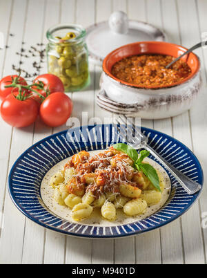 Gnocchi ragù. Italian potato dumplings with bolognese sauce. Italy Food Stock Photo