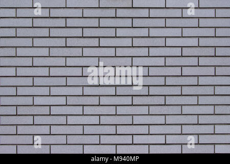 Modern gray brick wall background for building decoration. Stock Photo