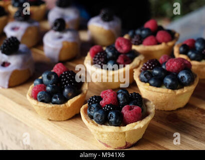 Berry tarts made by Snowdrop Cottage, on sale at farmers' market at Whiteladies Road, Bristol, UK Stock Photo