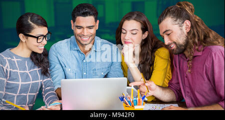 Composite image of colleagues discussing over laptop Stock Photo