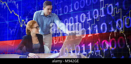 Composite image of colleagues discussing over computer at table Stock Photo