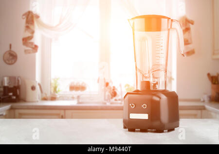 White kitchen machine and stand mixer on a wooden table in a bright design  apartment Stock Photo - Alamy