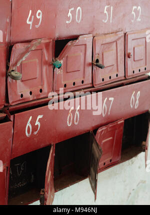 Broken mailboxes in the entrance of an apartment building Stock Photo