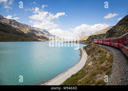 Bernina Railway links St. Moritz, Switzerland, with the town of Tirano, Italy, via the Bernina Pass Stock Photo