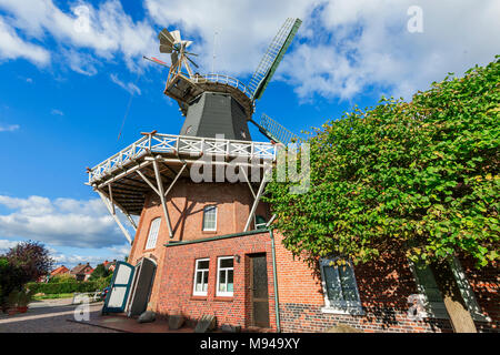 Wide angle view on the Pelde Mill in front of blue sky with small clouds. Stock Photo