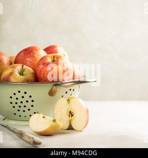 Fresh apples in metal strainer Stock Photo