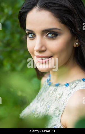 Happy young woman smiling outdoors Stock Photo