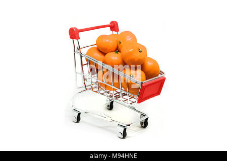Metal shopping basket on wheels with red handle with mandarin inside isolated on white background, consumer basket, food cart, front and side view Stock Photo