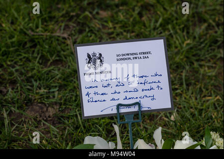 London, UK. 22nd March 2018, The Prime Minister's card on flowers at the memorial commemorating the first anniversary of the Westminster Terror attack. Credit: Ian Davidson/Alamy Live News Stock Photo