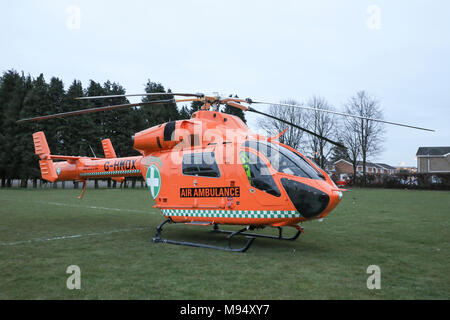Luton, UK. 22nd Mar, 2018. Paramedics respond to an emergency call in Luton, Bedfordshire and land their MD-900 Air Ambulance helicopter at Crawley Green Park. Credit: Nick Whittle/Alamy Live News Stock Photo