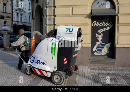 https://l450v.alamy.com/450v/m9551h/a-city-street-cleaning-operative-pulls-an-electric-glutton-waste-vacuum-cleaner-past-a-dog-shop-on-milady-horakove-street-holesovice-district-prague-7-on-20th-march-2018-in-prague-the-czech-republic-m9551h.jpg