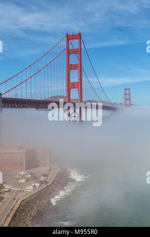 View of the Golden Gate Bridge and Fort Point with thick low fog,  San Francisco, California, United States. Stock Photo