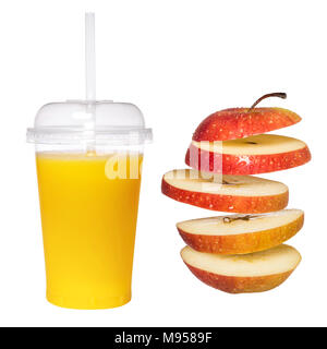Fresh apple juice in a transparent glass with a tube. Falling sliced apple on a white background. Creative concept with flying fruit Stock Photo