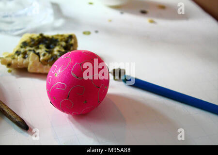 Decorating easter eggs with beeswax and a stylus. Stock Photo
