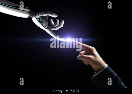robot and human hand connecting fingers Stock Photo