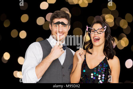 happy couple with party props having fun Stock Photo