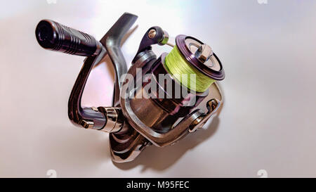 Spinning Reel Isolated on White Background. - Stock Photo