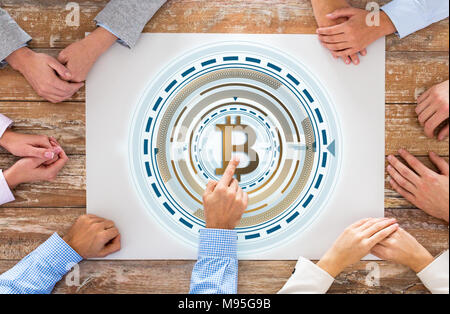 close up of business team hands with bitcoin Stock Photo