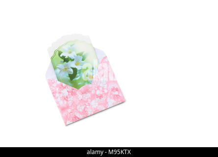 In a beautiful envelope with a pink pattern is a greeting card. Presented on a white background. Stock Photo