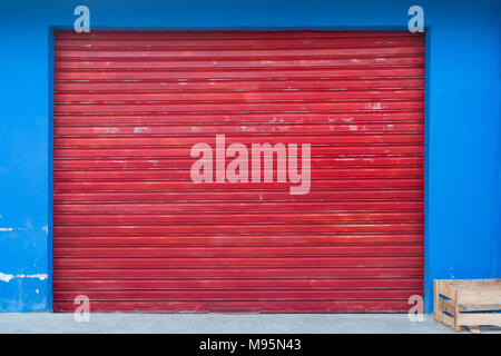 shutter background - shop exterior with closed red shutter  - Stock Photo