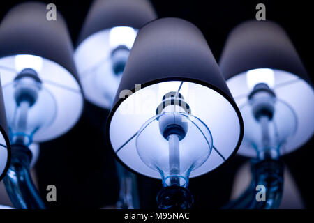 A luminous ceiling light among the shadow. Stock Photo