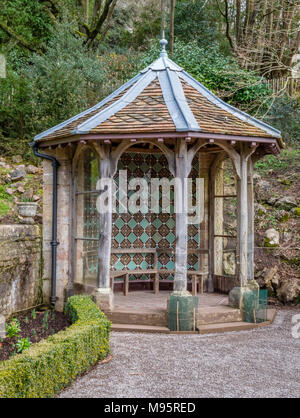 Summer house with green Victorian tiled walls in the corner of the parterre garden at Tyntesfield in Somerset UK Stock Photo