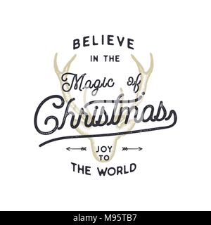 Christmas typography quote design. Believe in Christmas magic. Happy Holidays sign. Inspirational print for t shirts, mugs, holiday decorations, costumes. Stock vector calligraphy isolated Stock Vector