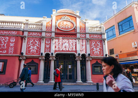 Madrid, Spain : People walk past cine Doré, the cinema of the Spanish Cinemathèque (Filmoteca Española) and featured by Pedro Almodóvar in Talk to Her Stock Photo
