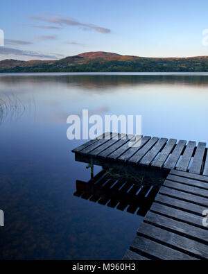 Wooden jetty on the shore of Lough Derg, County Clare, Ireland at sunset Stock Photo