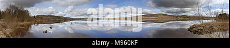 Clouds reflecting in the waters of Lough Graney, County Clare, Ireland on a sunny summer's day Stock Photo
