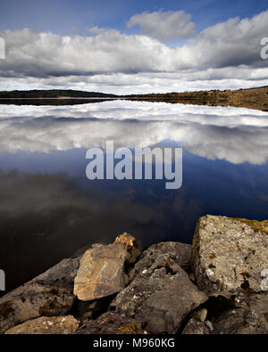Clouds reflecting in the waters of Lough Graney, County Clare, Ireland on a sunny summer's day Stock Photo