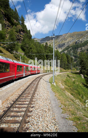 Bernina Railway links St. Moritz, Switzerland, with the town of Tirano, Italy, via the Bernina Pass Stock Photo