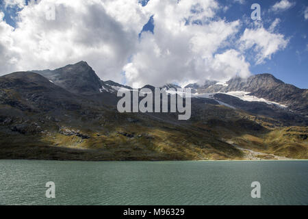 Bernina Railway links St. Moritz, Switzerland, with the town of Tirano, Italy, via the Bernina Pass Stock Photo