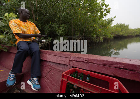 Fishermen and their catch south of Denton Bridge, in the Tanbi Wetland Complex. Stock Photo