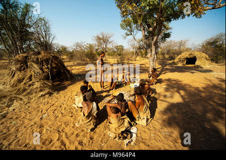 Ju/'Hoansi or San bushmen in daily activities at their village, Grashoek, Namibia Stock Photo