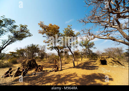 Ju/'Hoansi or San bushmen in daily activities at their village, Grashoek, Namibia Stock Photo