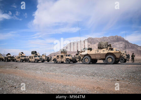 Convoy of Afghan Commando Company, consisting of HMMWVs and Mobile Strike Force Vehicles, resting on the main road in Bolo Bluk district, Farah province. Afghanistan’s elite military forces – the Commandos and the Special Forces are one of the key elements in the Afghan and U.S. strategy to turn the grinding fight against the Taliban and other insurgents around. These pictures show the Commandos and Special Forces during training and in the field; also right before and after an operation in the restive western Afghan province of Farah. Stock Photo