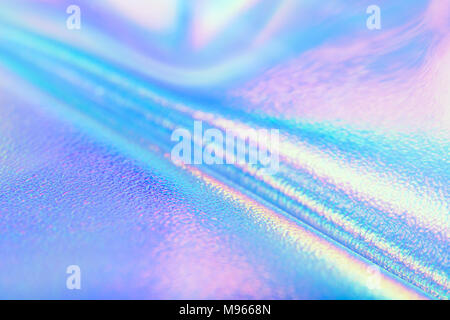 Bright real holographic foil texture in pastel neon colors. Holographic foil texture for your design. Stock Photo