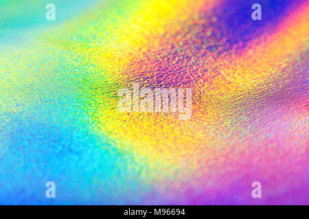 Rainbow real holographic foil texture background. Holographic background. Vibrant neon texture. Trendy background. Stock Photo