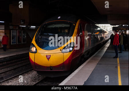 Class 390 Virgin Pendolino train approaches Birmingham International Railway Station  with a service to London Euston, UK. Stock Photo