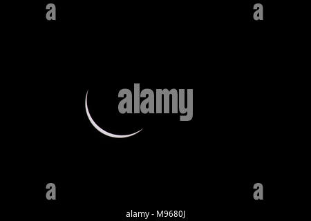 A thin crescent of the sun remains near the moment of the total solar eclipse as seen in Oregon, United States in 2017 Stock Photo