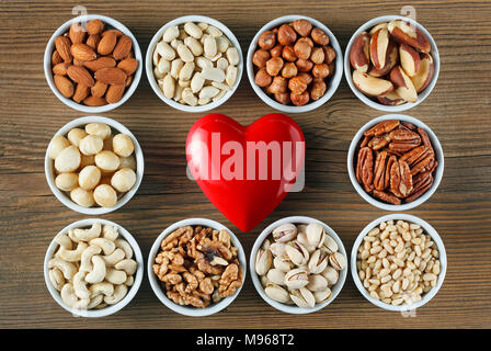 Different types of nuts in small bowls. Healthy food concept Stock Photo