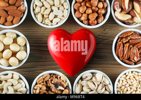 Different types of nuts in small bowls. Healthy food concept Stock Photo