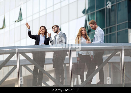 Business people and colleagues talking outdoors Stock Photo